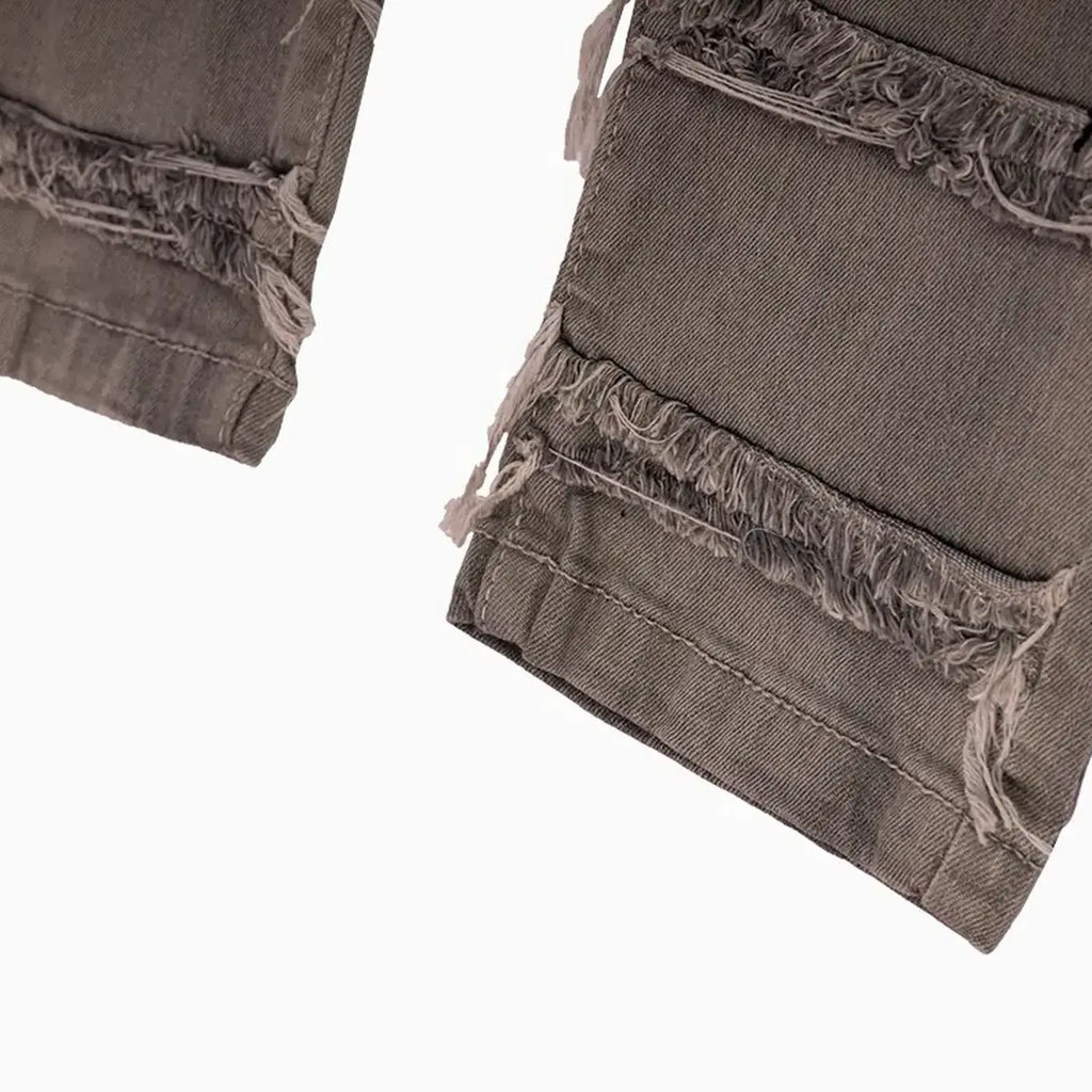 Pantalón vaquero desgastado y roto de niño con OPS