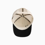 Casquette trucker crâne en similicuir