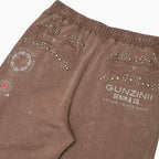 Conjunto de jogger con gráficos y tachuelas para hombre