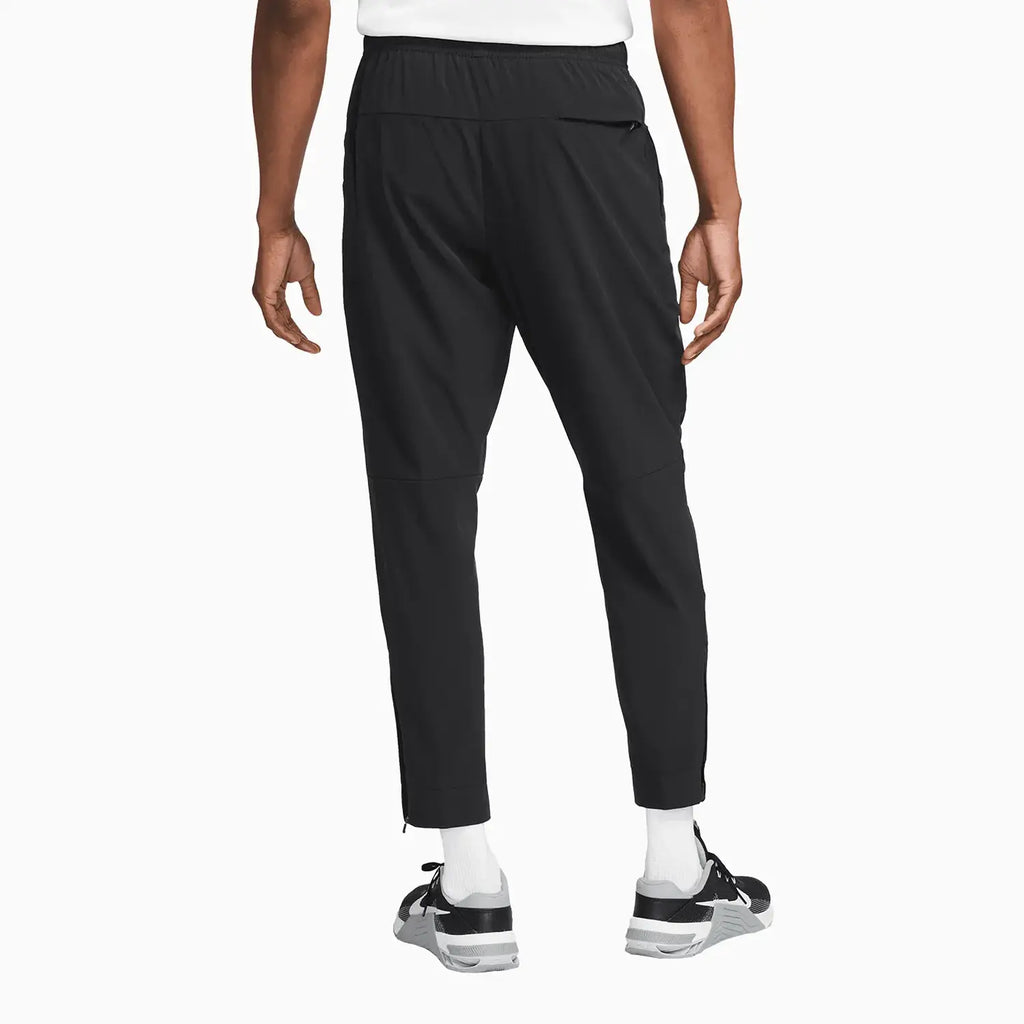 Pantalón de chándal Dri-Fit sin límites para hombre con puños con cremallera