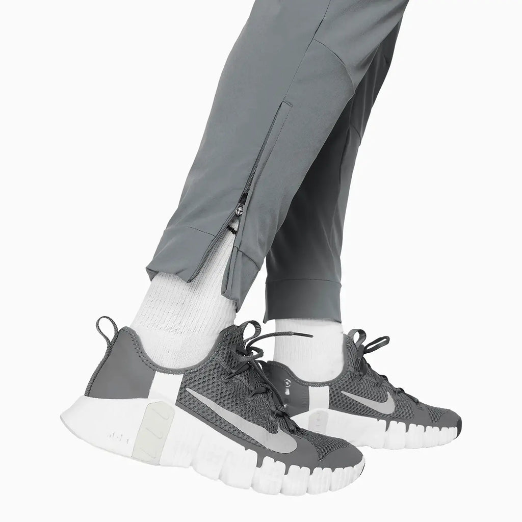 Pantalon de survêtement Dri-Fit pour homme avec poignets zippés
